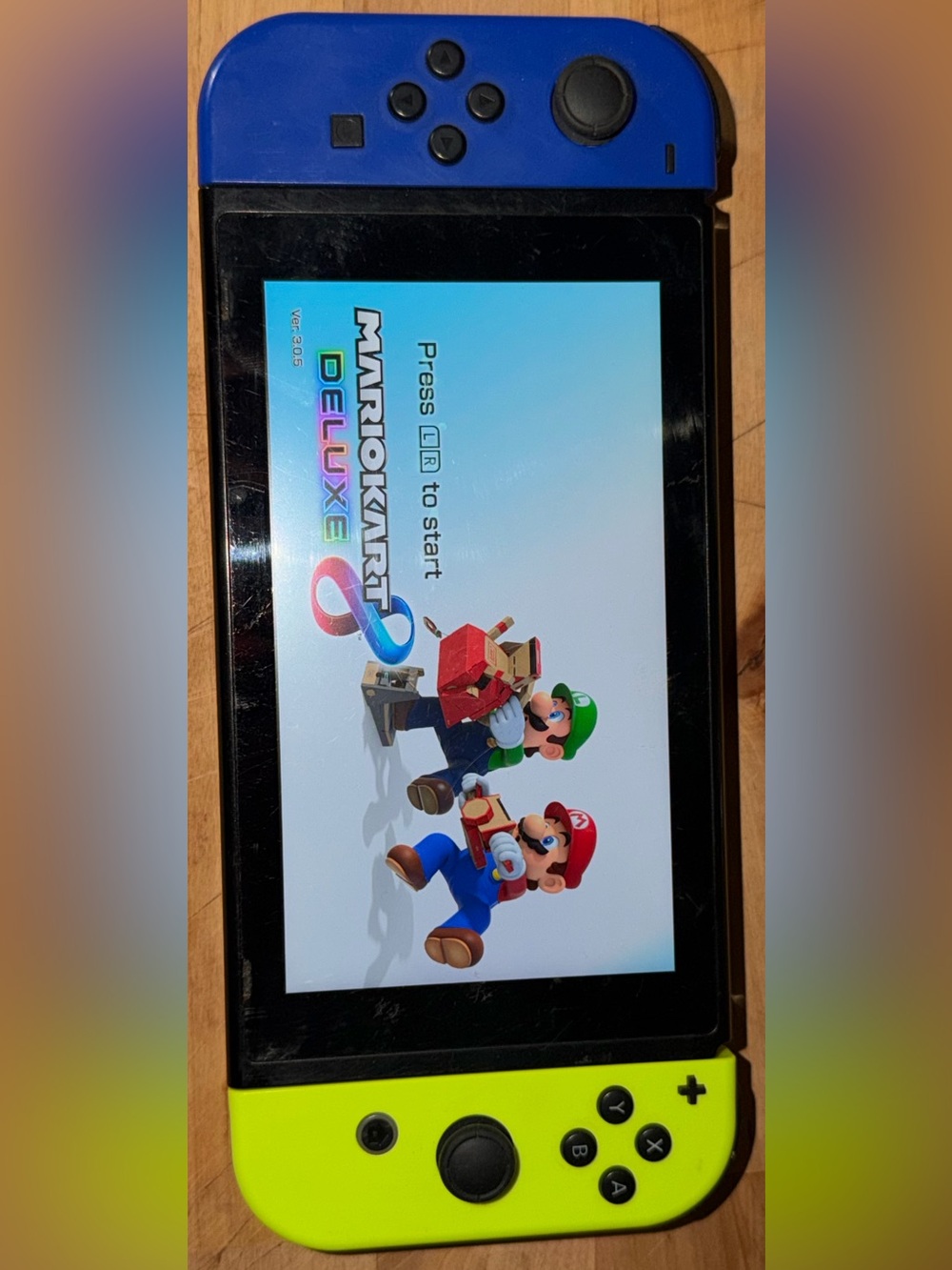 Nintendo Switch with Black Bezel and Colorful Game Screen